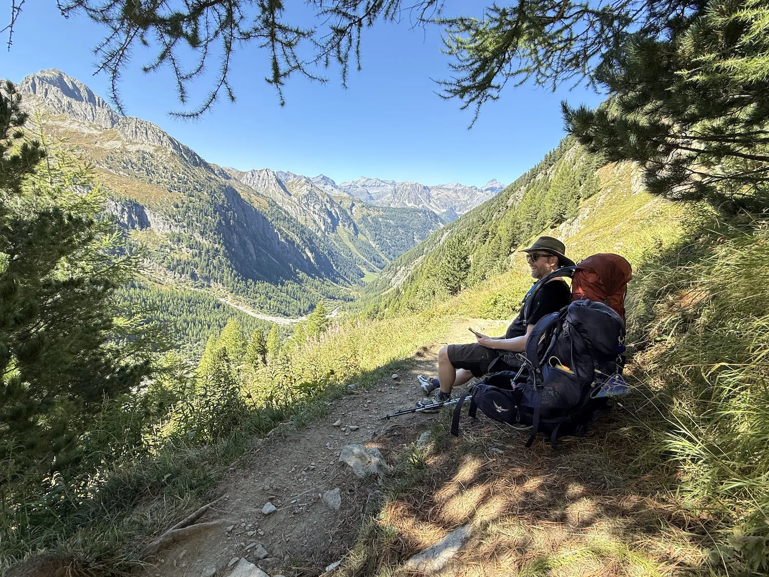 Grant sitting with backpack resting