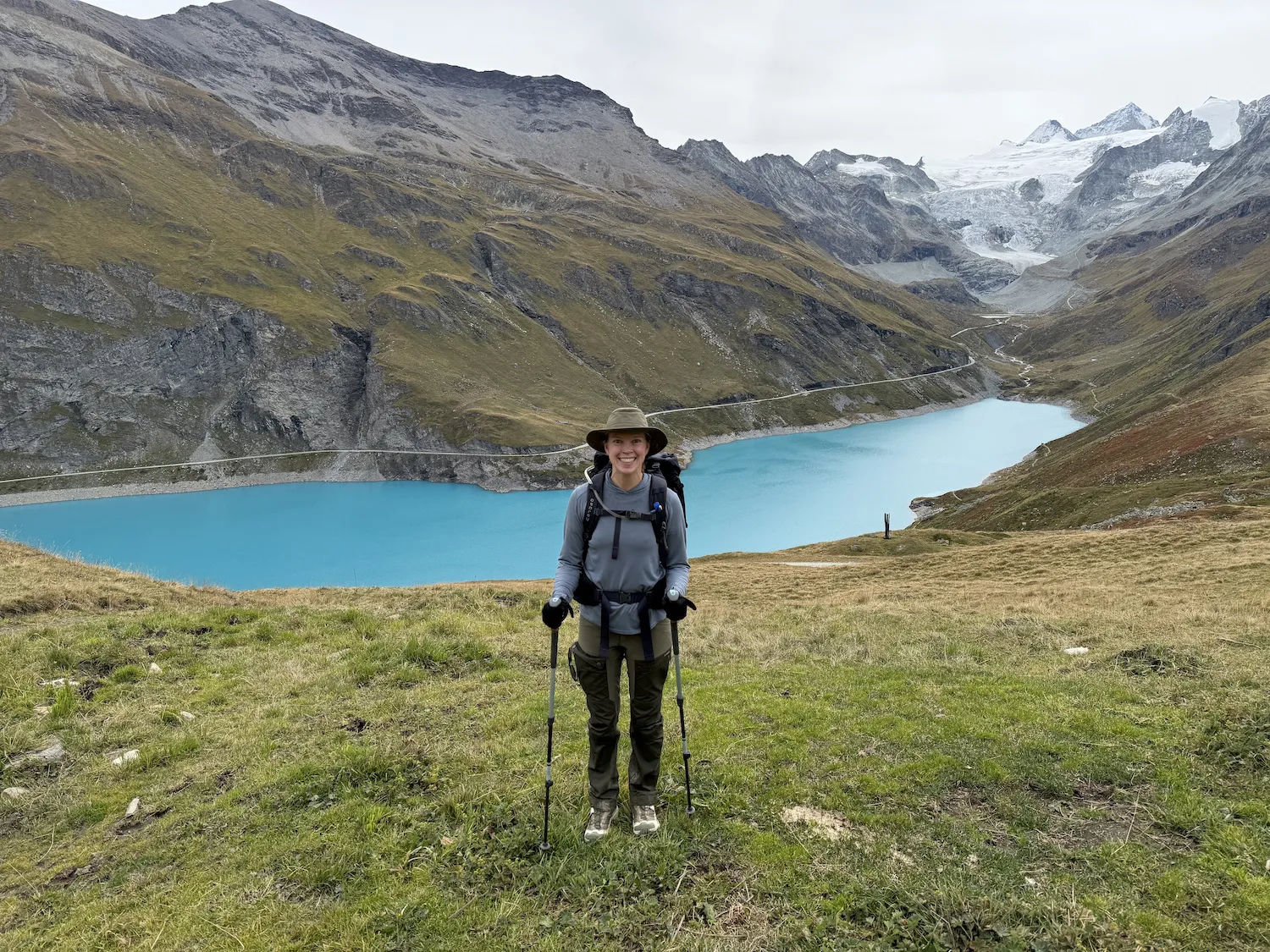 Woman in front of blue lake