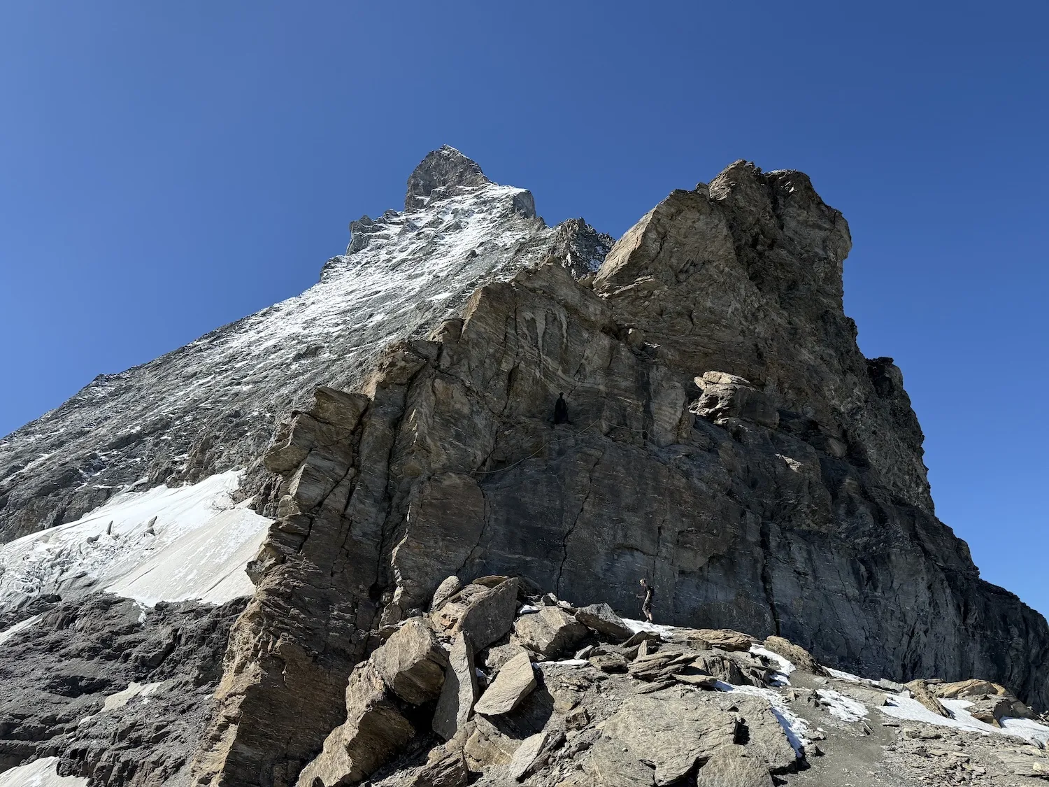 Man in the distance walking towards mountain