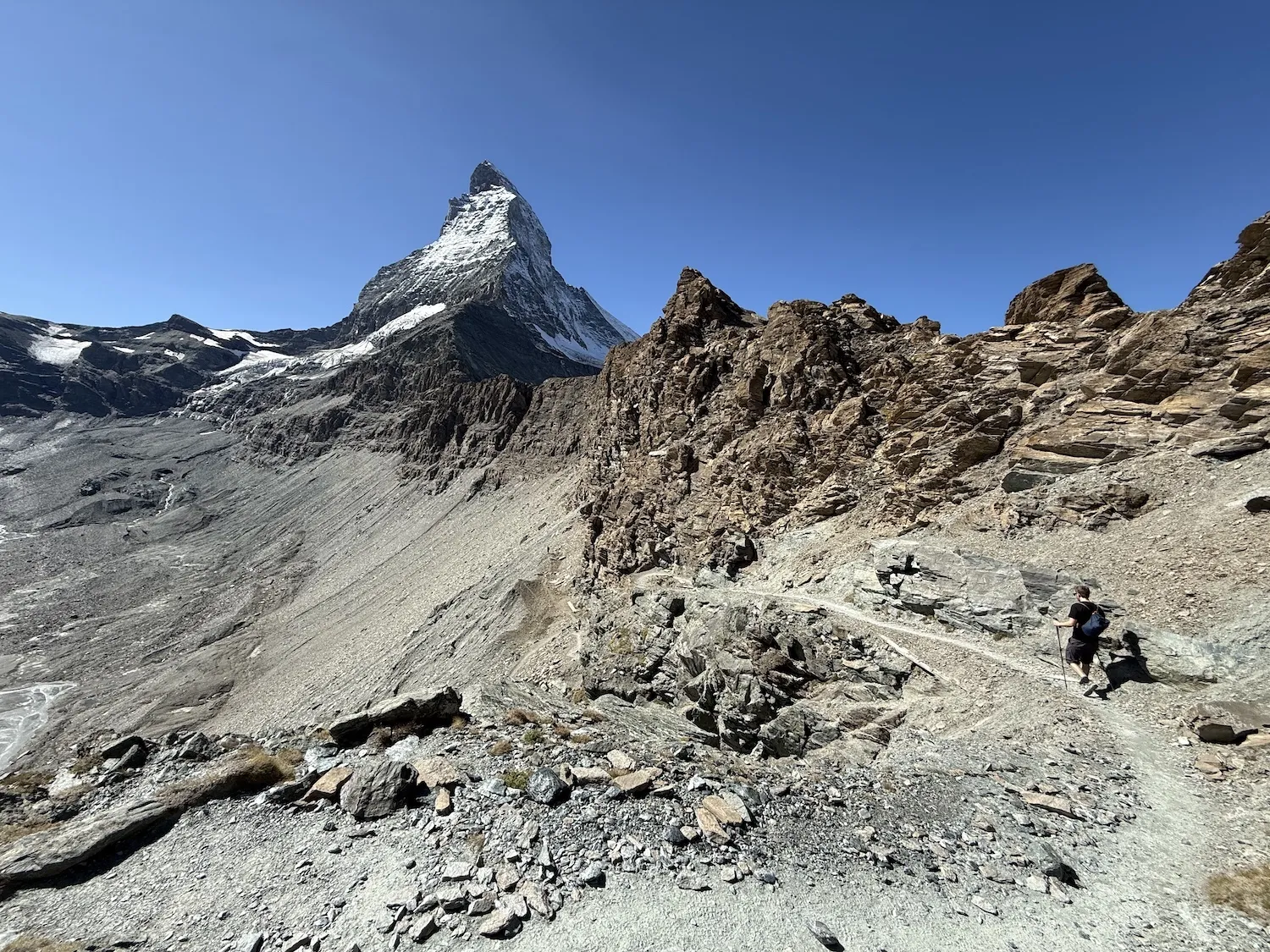 Man walking in front of the Matterhorn