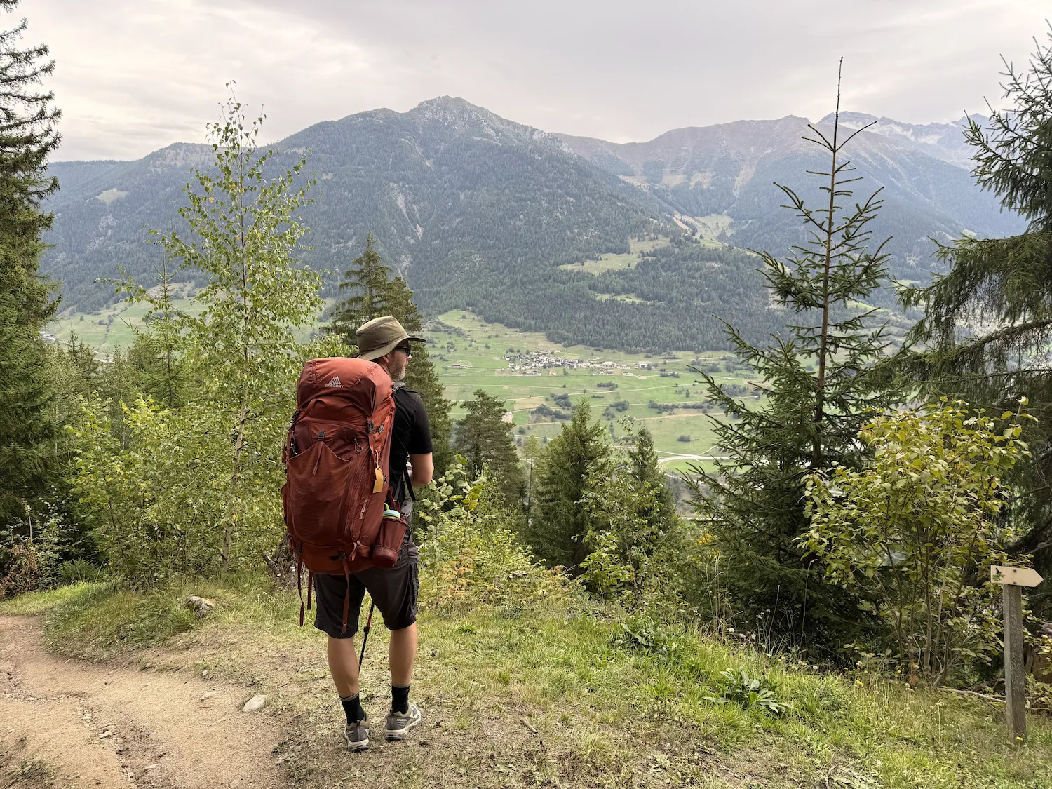 Grant standing in front of mountains