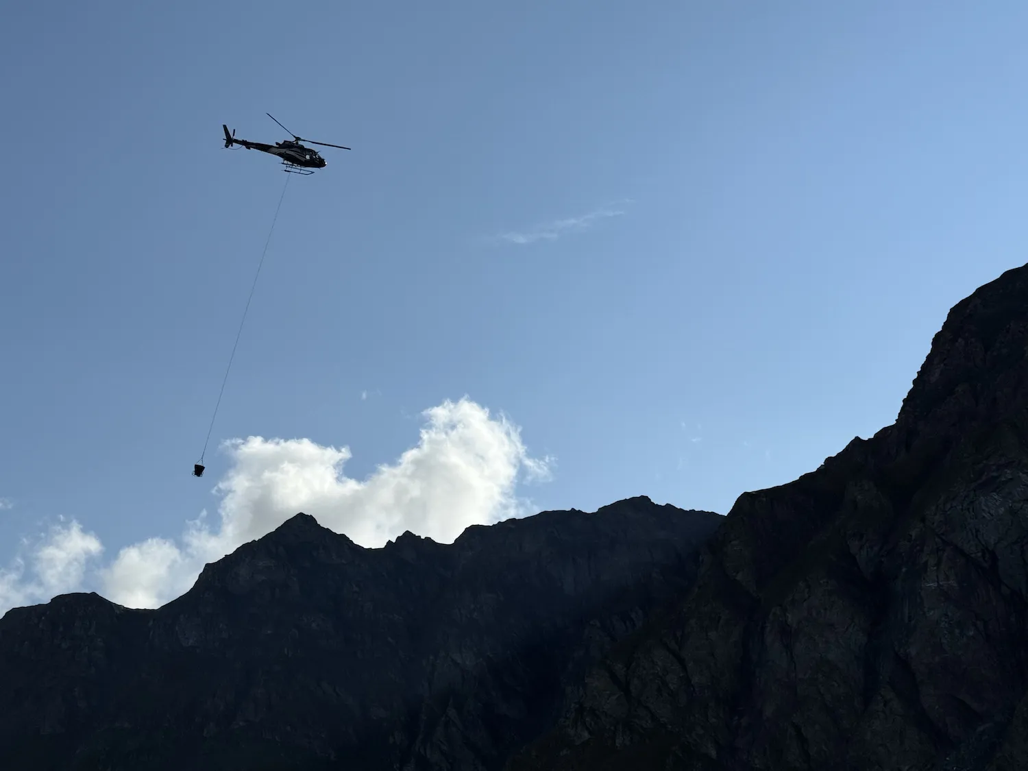 Helicoptor flying in mountains