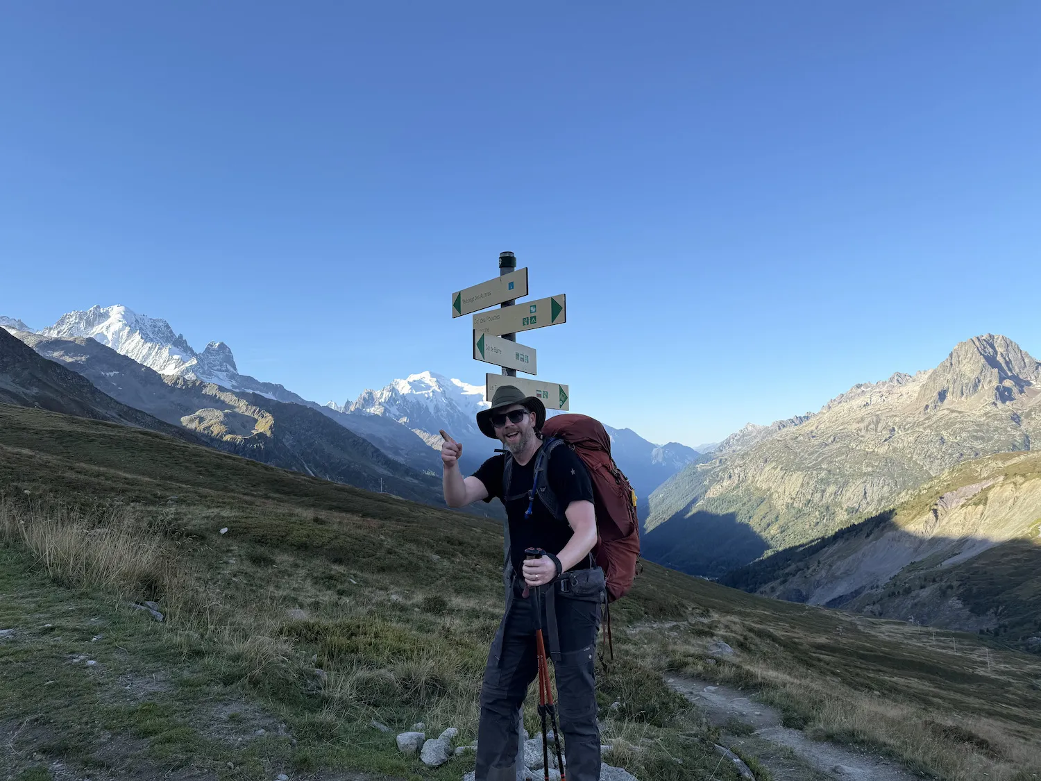 Grant standing in front of mountains