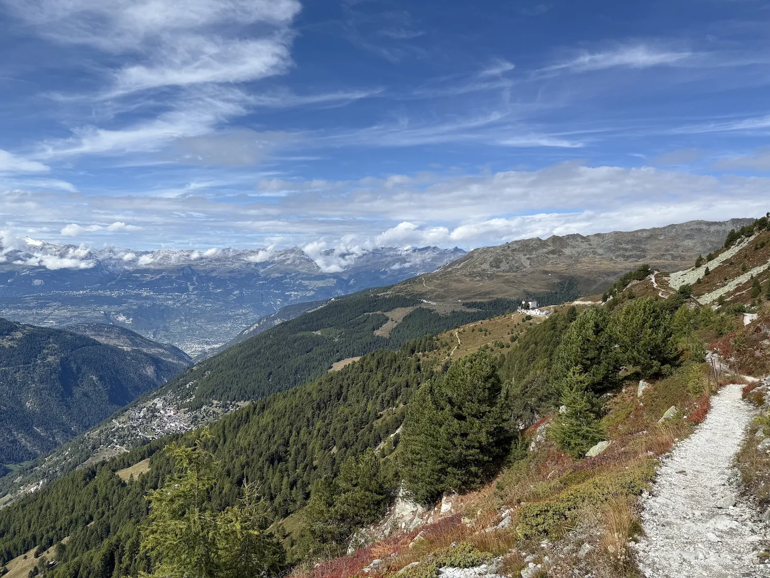 Hilly trail with hotel in teh distance