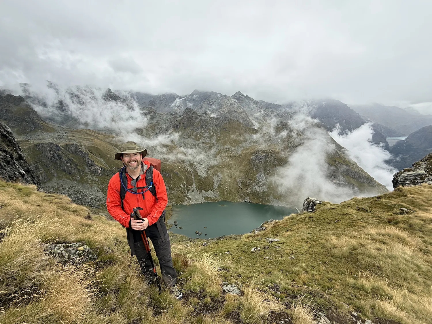 Man in front of lake far below