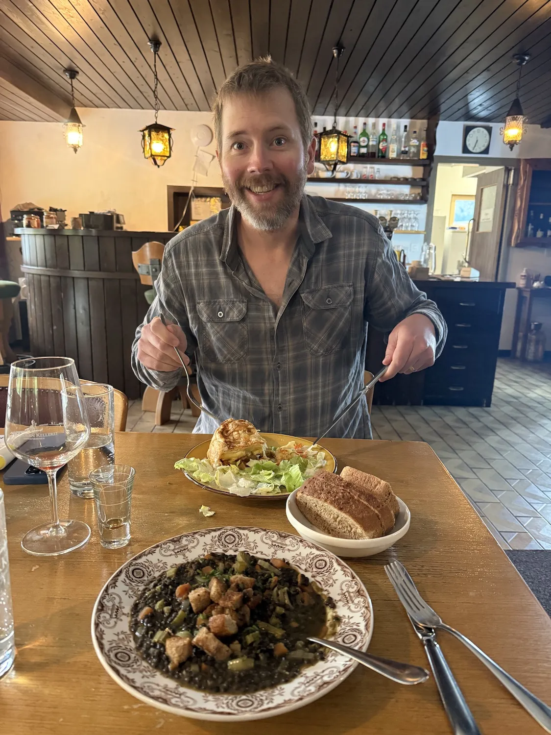 Man in front of two dinner plates