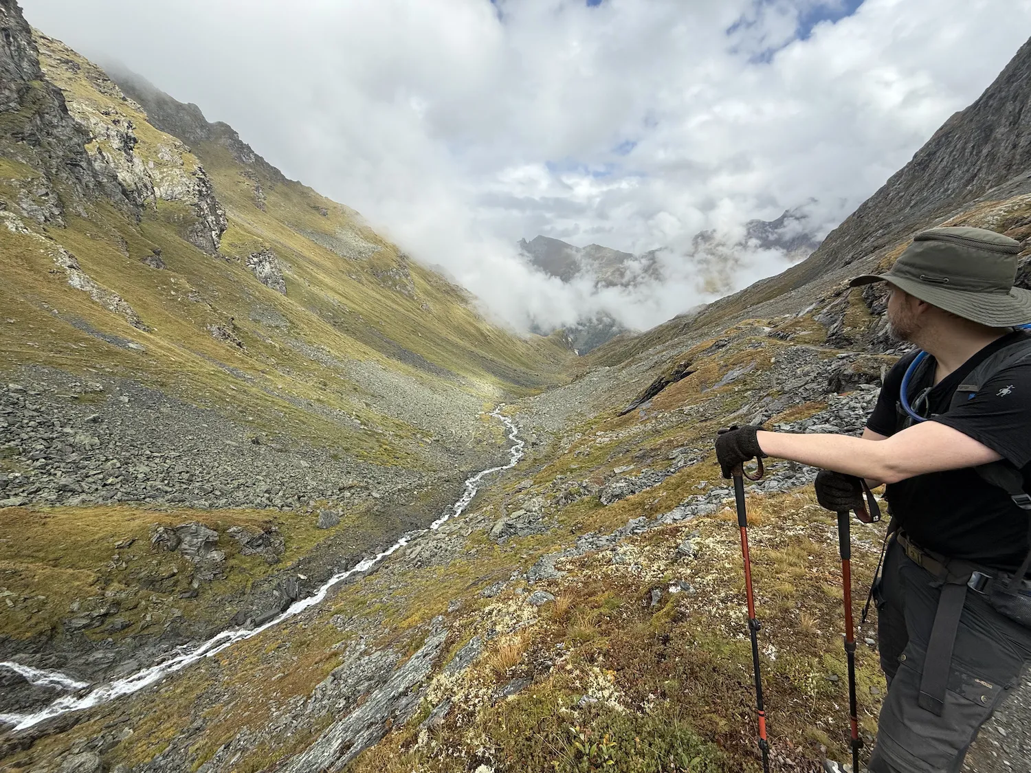 Man resting and overlooking a river