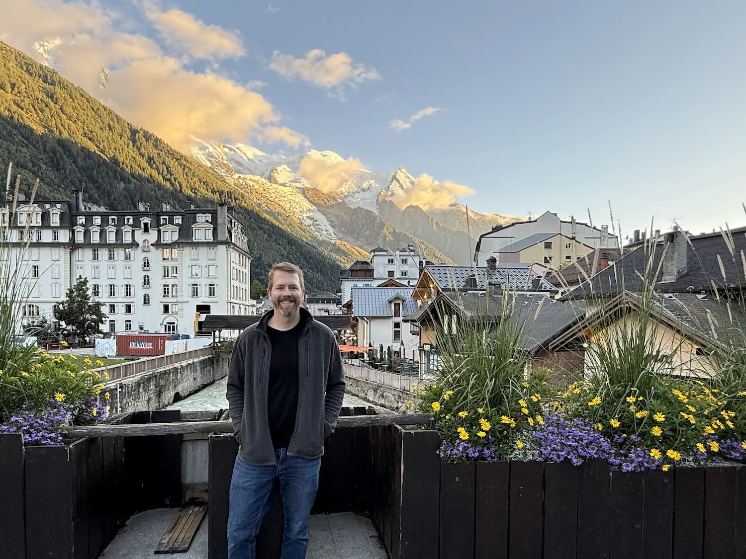 Grant standing in front of a river and mountains