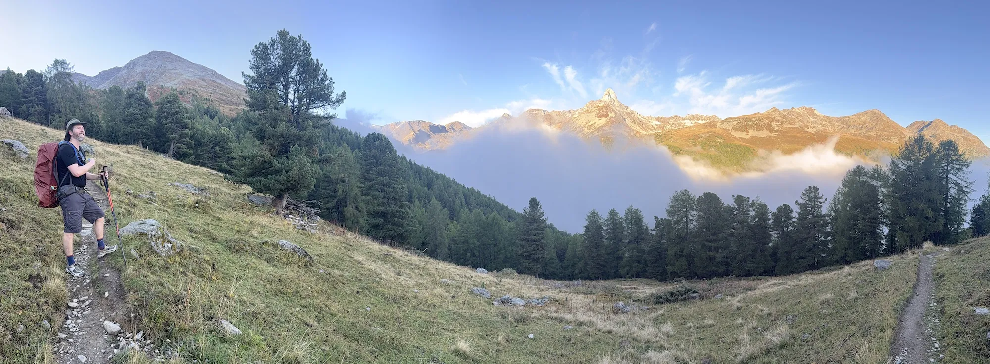 Panoramic view of man and cloudy mountains