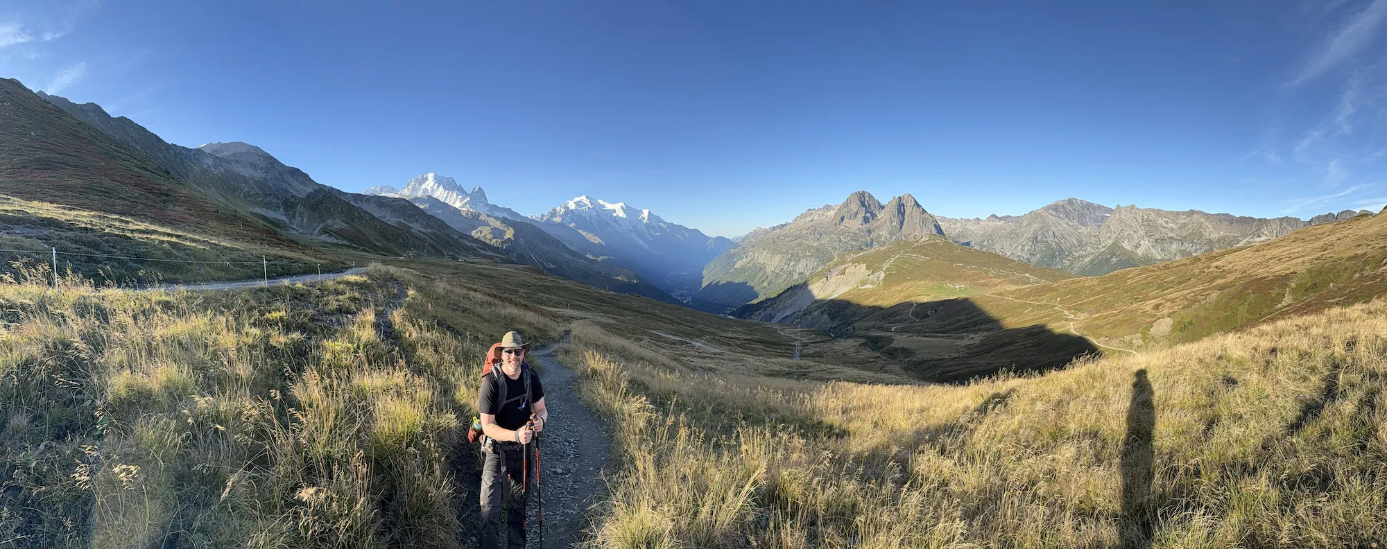 Grant standing in front of mountains
