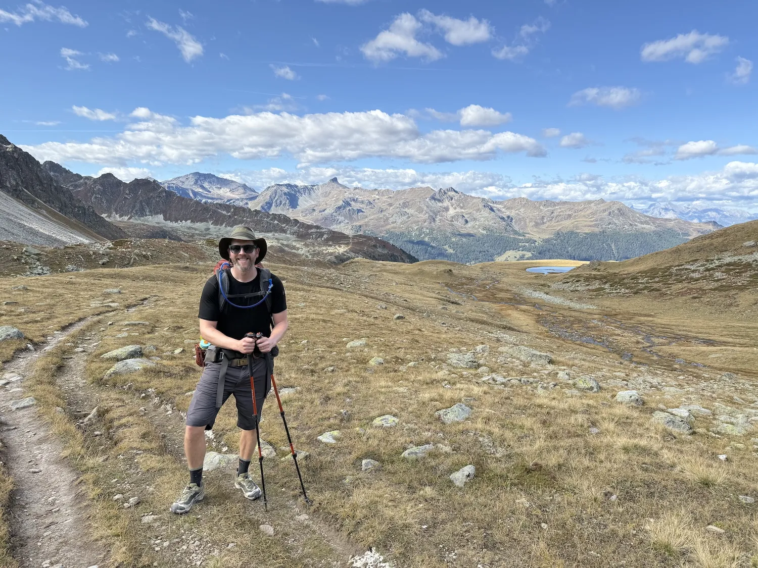 Man standing with mountains in the distance