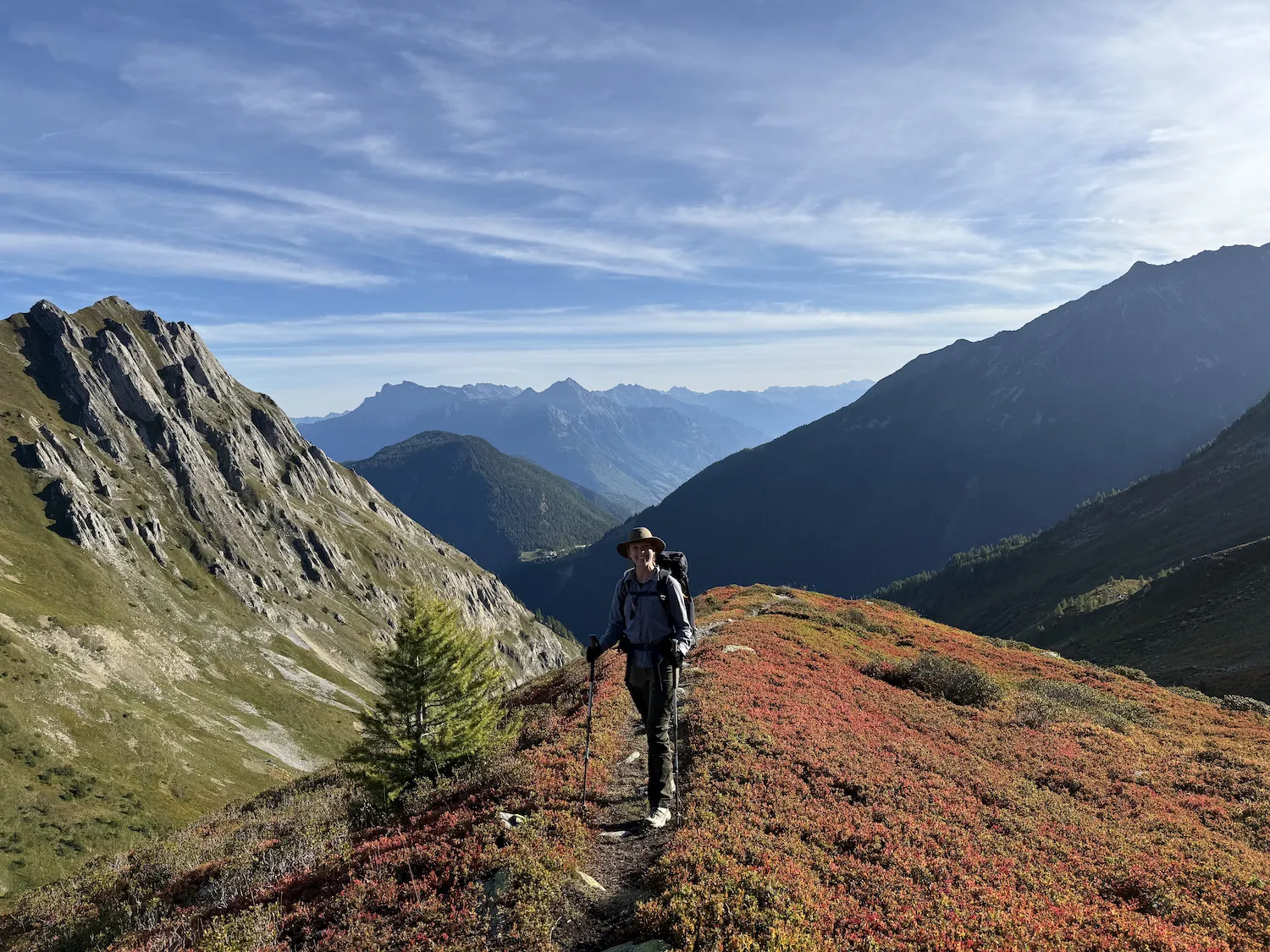 Sheryl standing in with red flowers