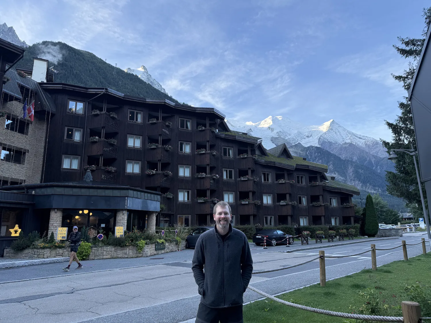 Grant in front of hotel with mountains in the background