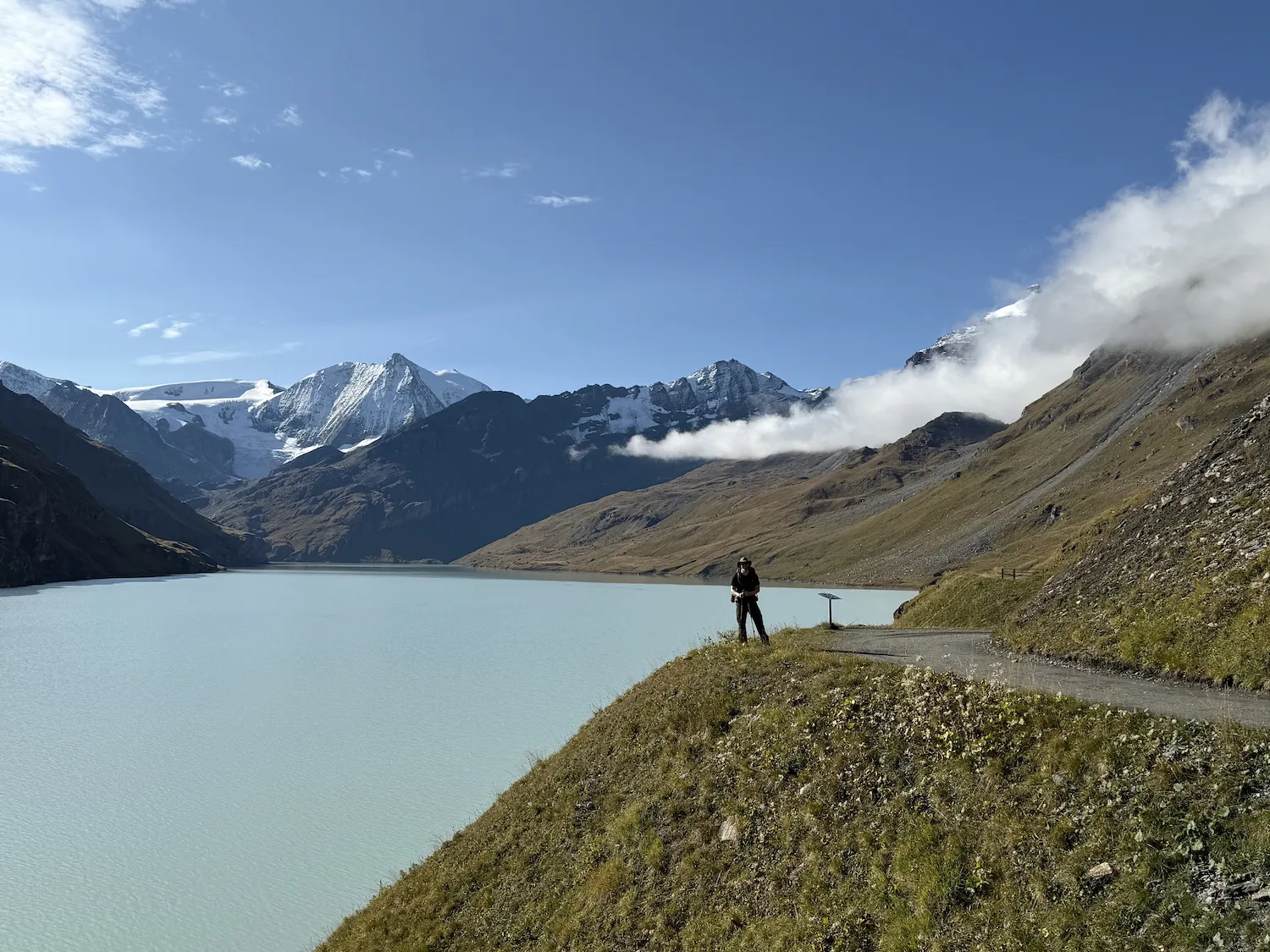 Man standing next to lake