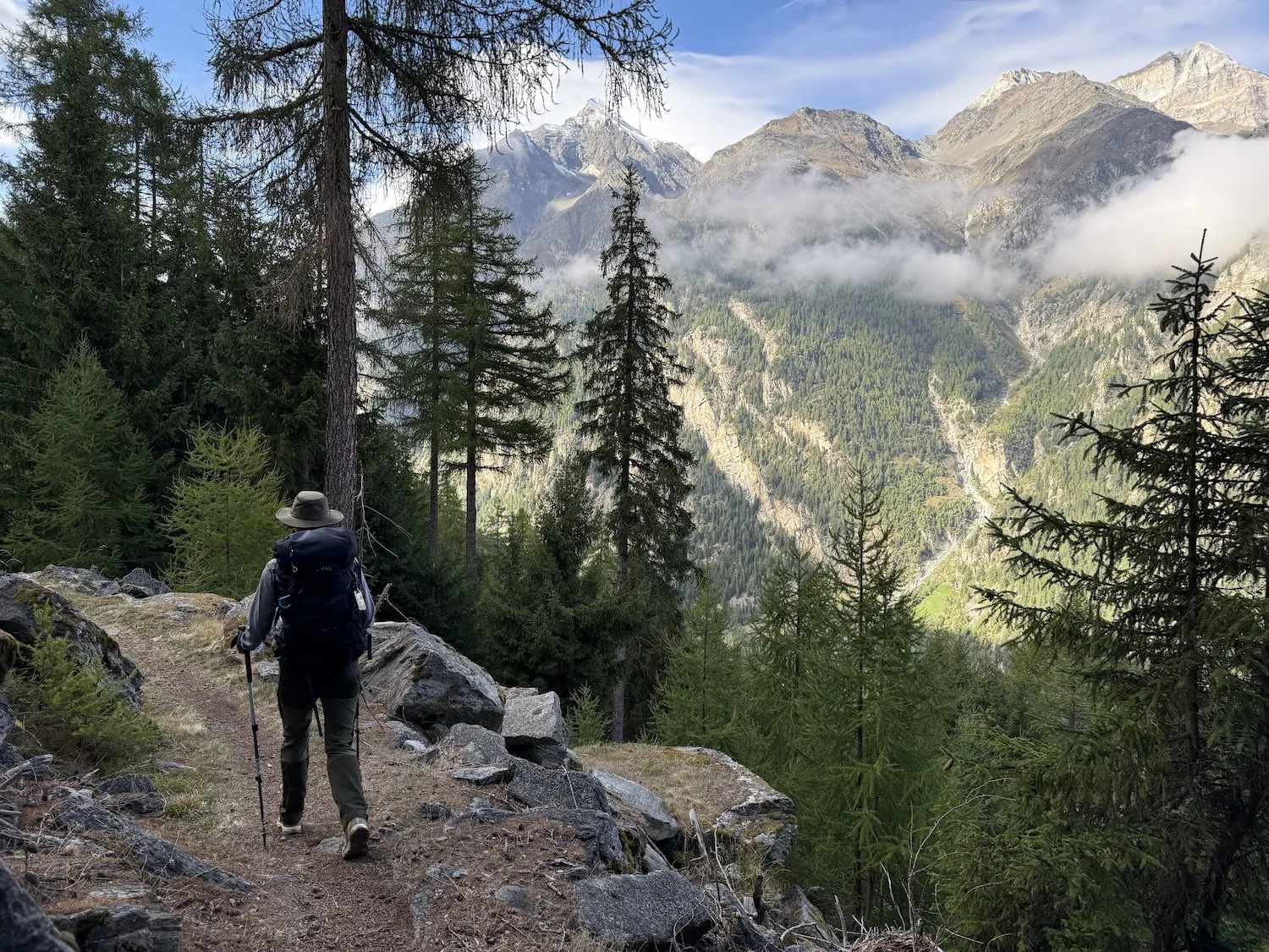 Woman walking on path in mountains