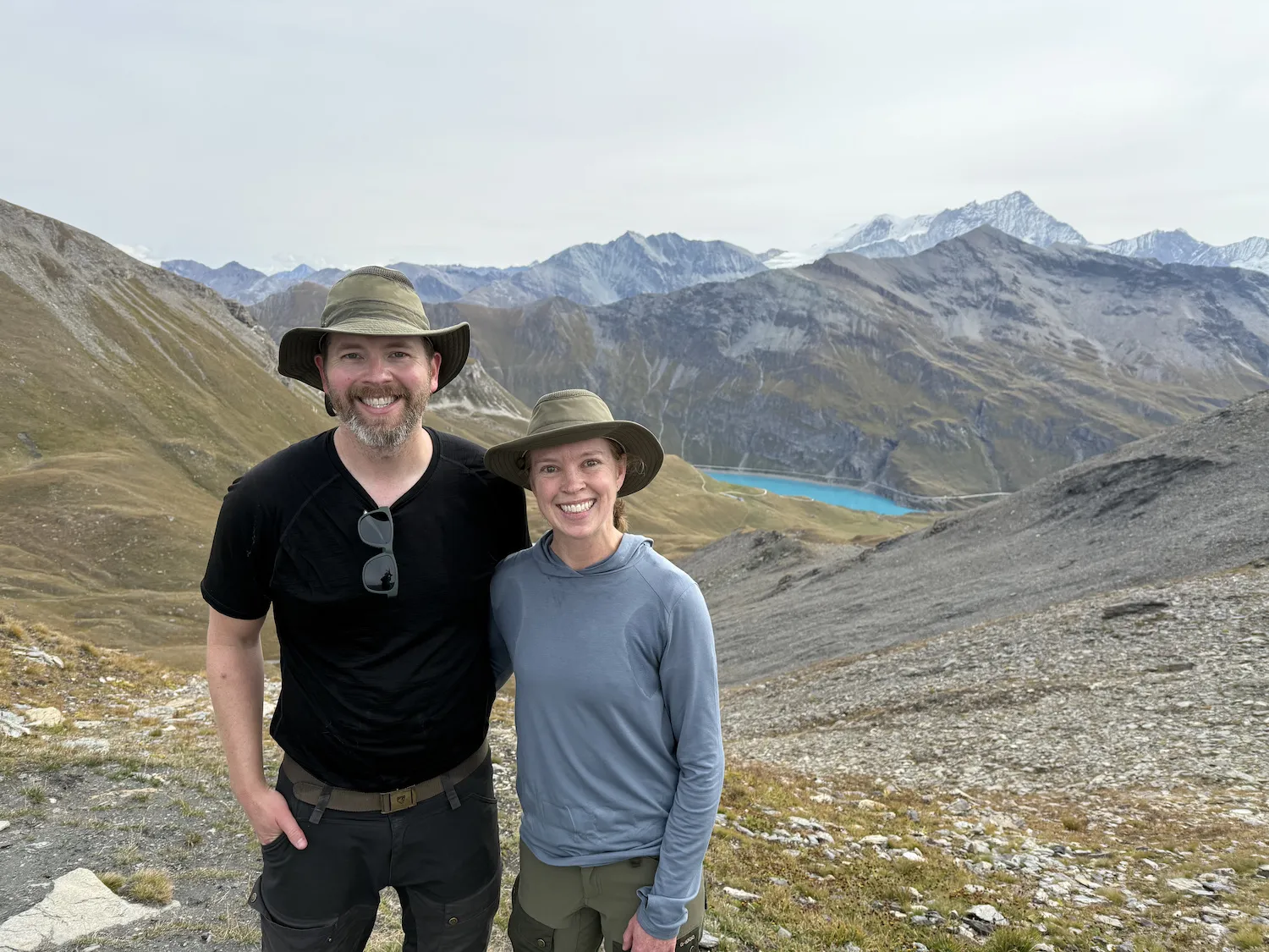 Woman and man in front of lake and mountains