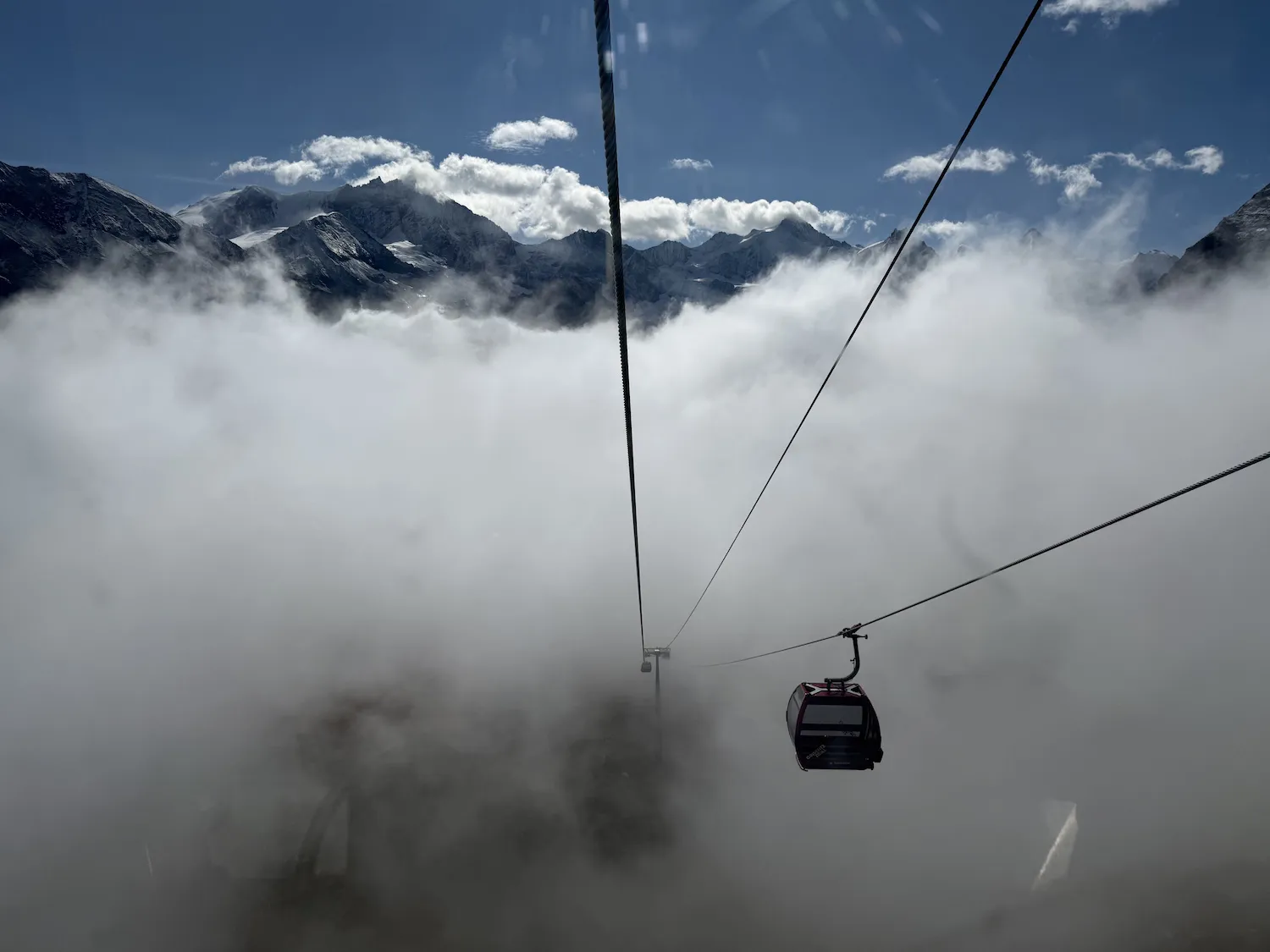Gondola descending into the clouds