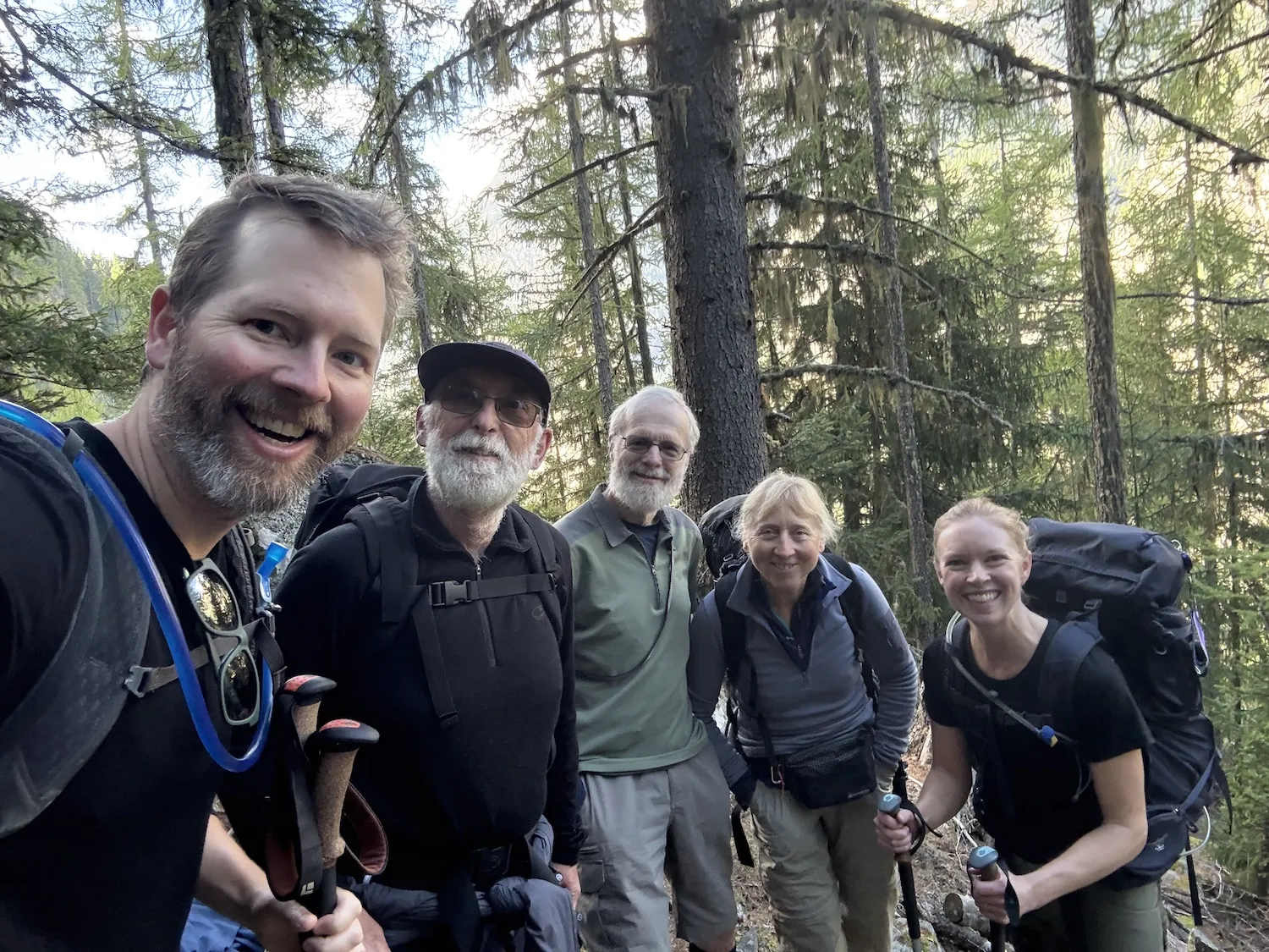 Group photo fo five people in the mountains