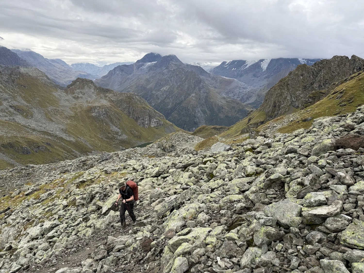 Man walking through boulders