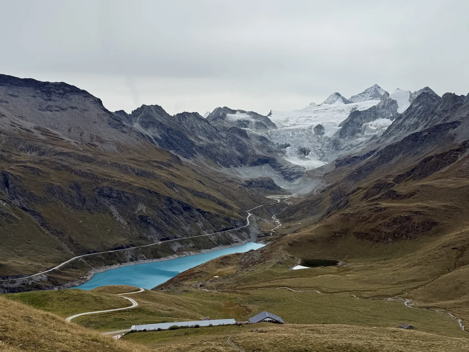 Glacier above a blue lake