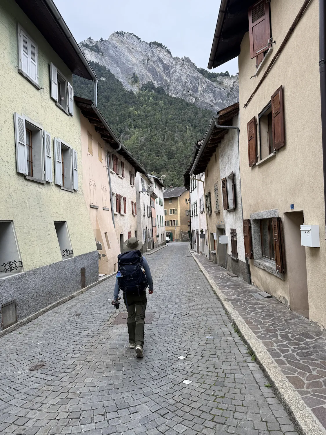 woman walking through a small town