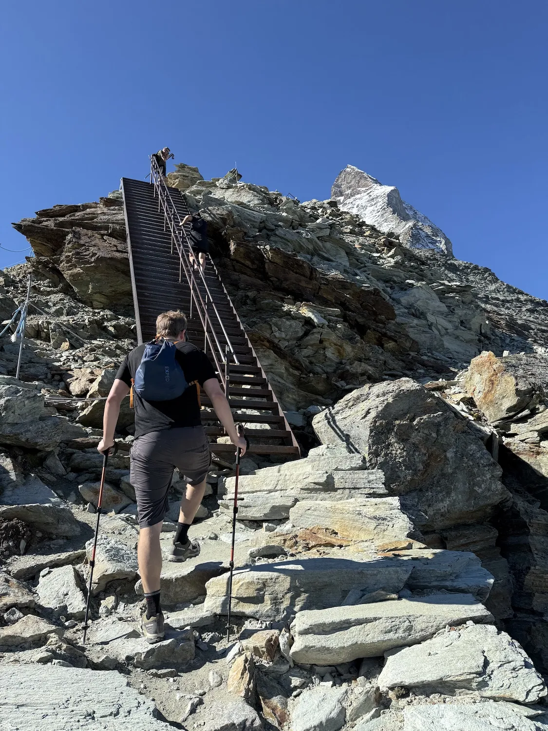 Man climbig stairs up mountain