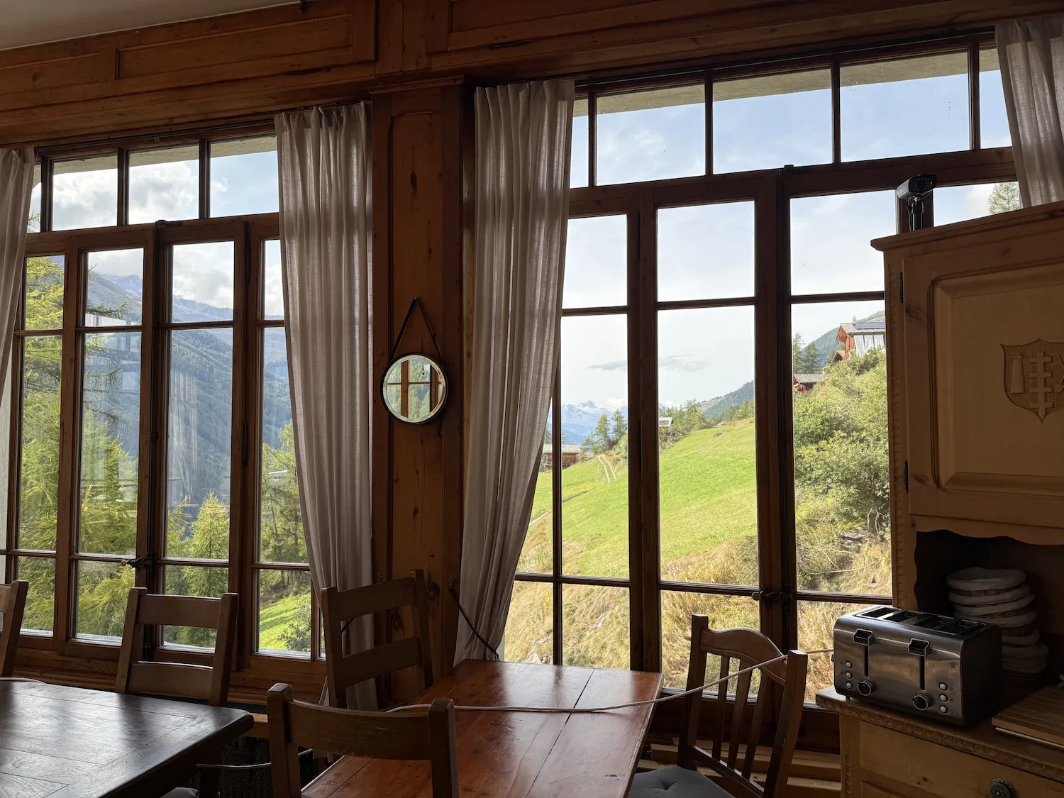 Dining room with many windows and field views