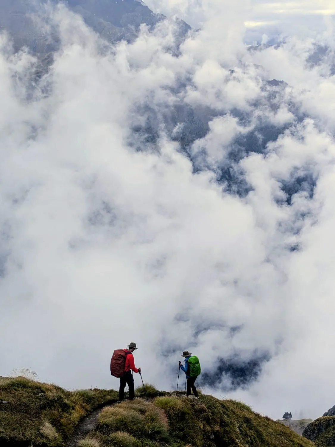 Woman and man walking away in the midst of clouds