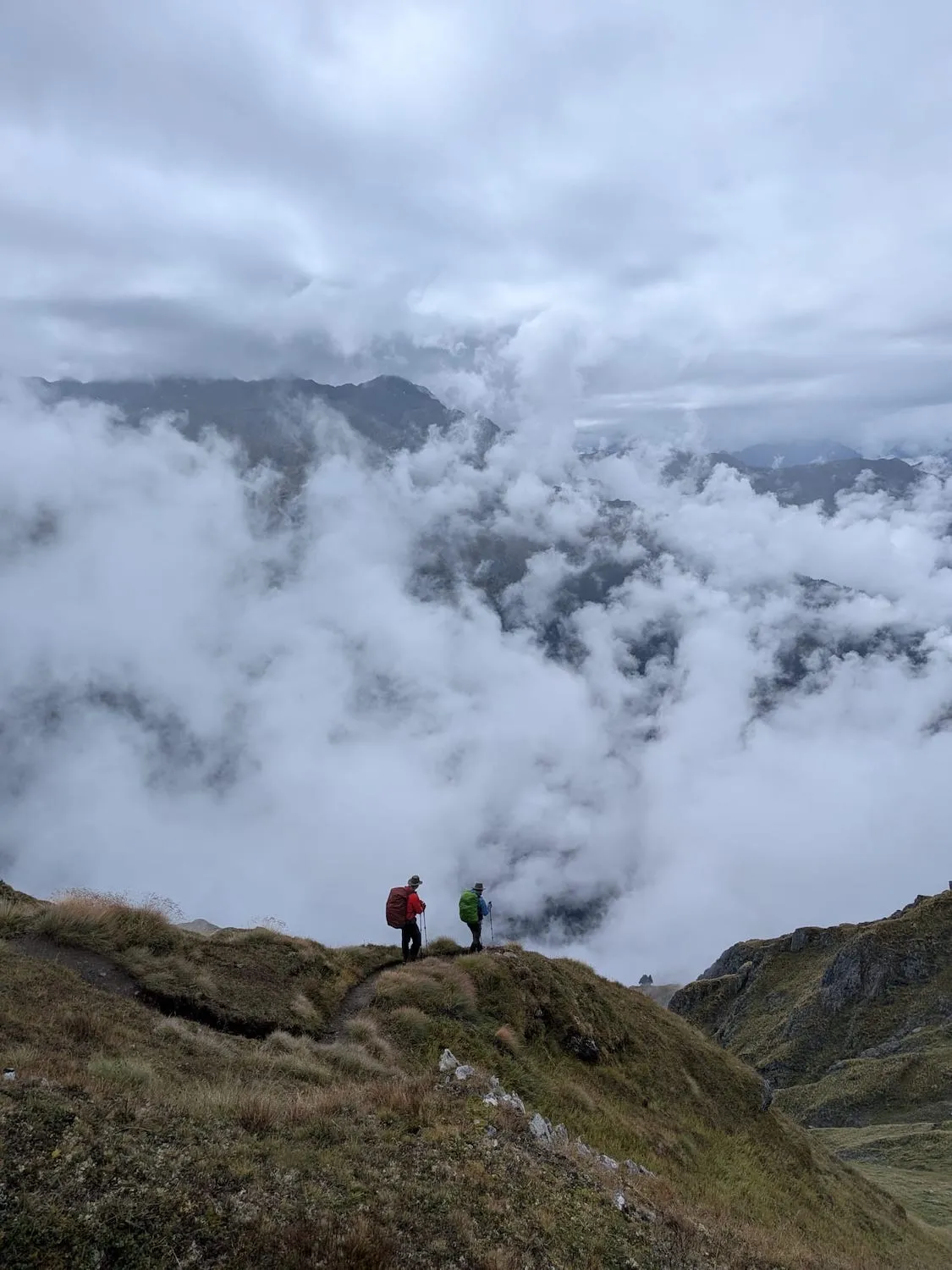 Woman and man walking away in the midst of clouds